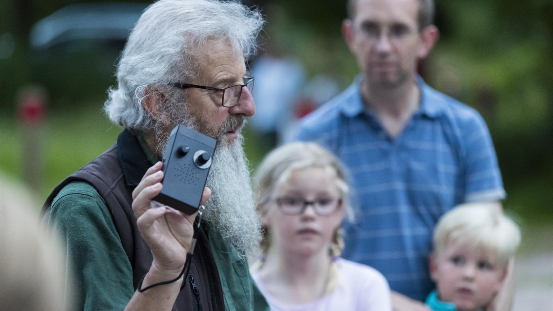 A National Trust ranger holding a bat detector