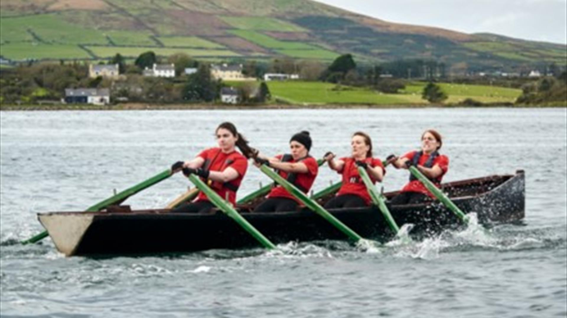 4 women rowing