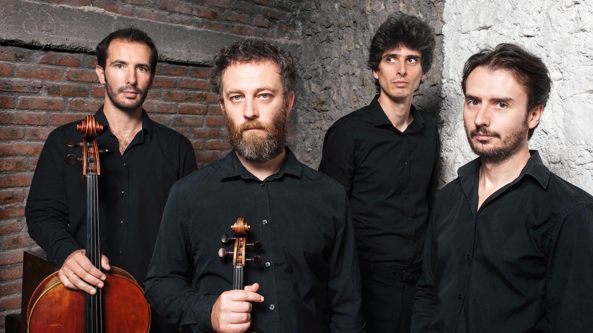 Four members of Quaturo Belo shown with their string instruments