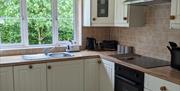 Picture of bathroom showing velux window, toilet, shower and the edge of the sink