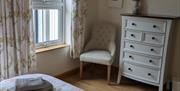 Picture of bathroom showing velux window, toilet, shower and the edge of the sink