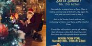 Santa Claus sitting in a chair at a 'Santa Sunday Lunch' event, where children can meet him. A festive sign or text beside him reads 'Santa Sunday Lun